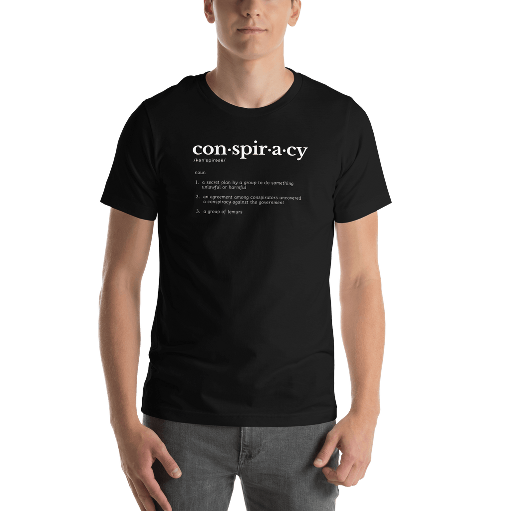 Conspiracy definition T-shirt worn by a person, black with con·spir·a·cy dictionary print
