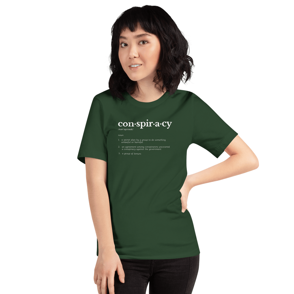 Conspiracy definition T-shirt worn by a person, forest green with con·spir·a·cy print