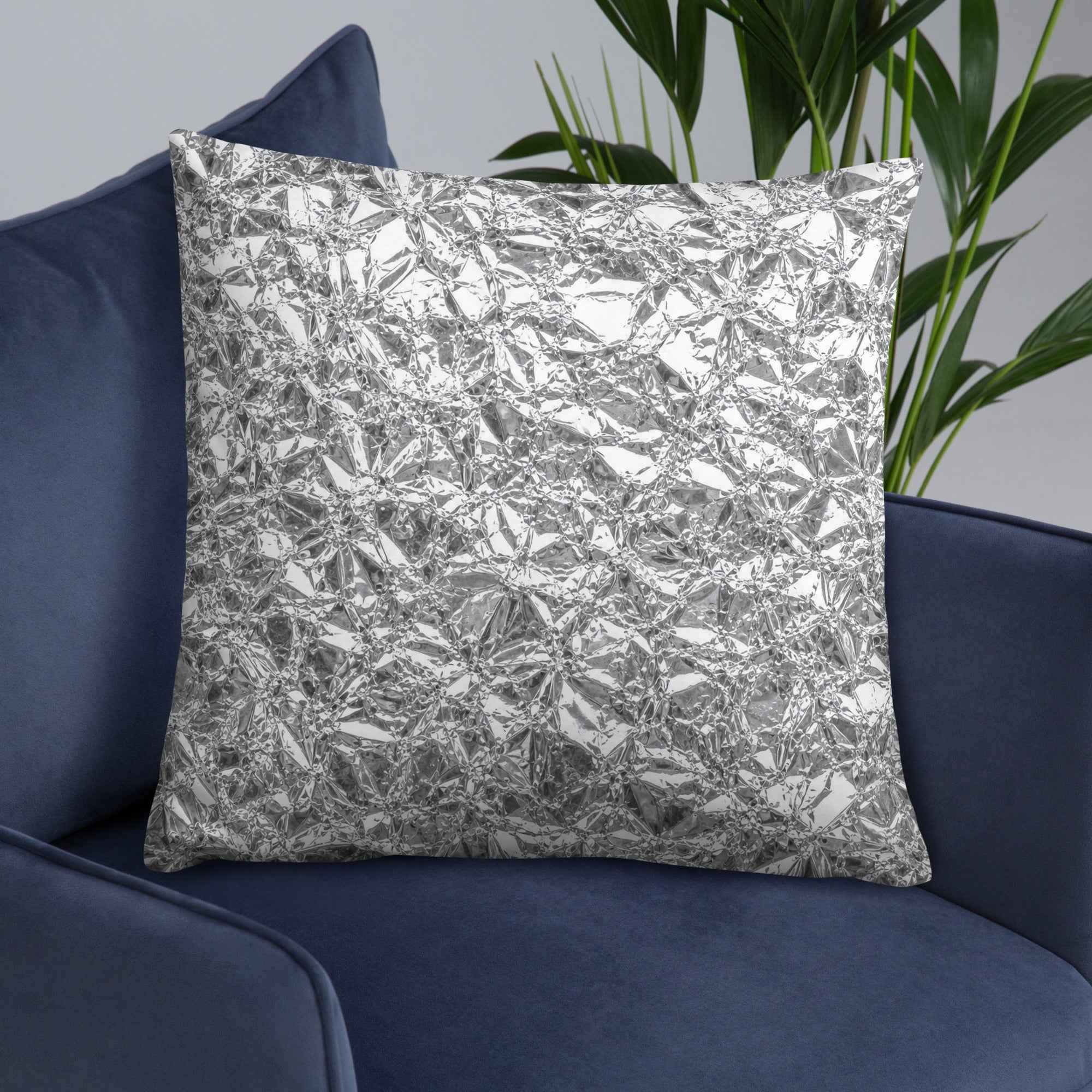 Shiny silver foil-texture throw pillow, square, crinkled reflective pattern.